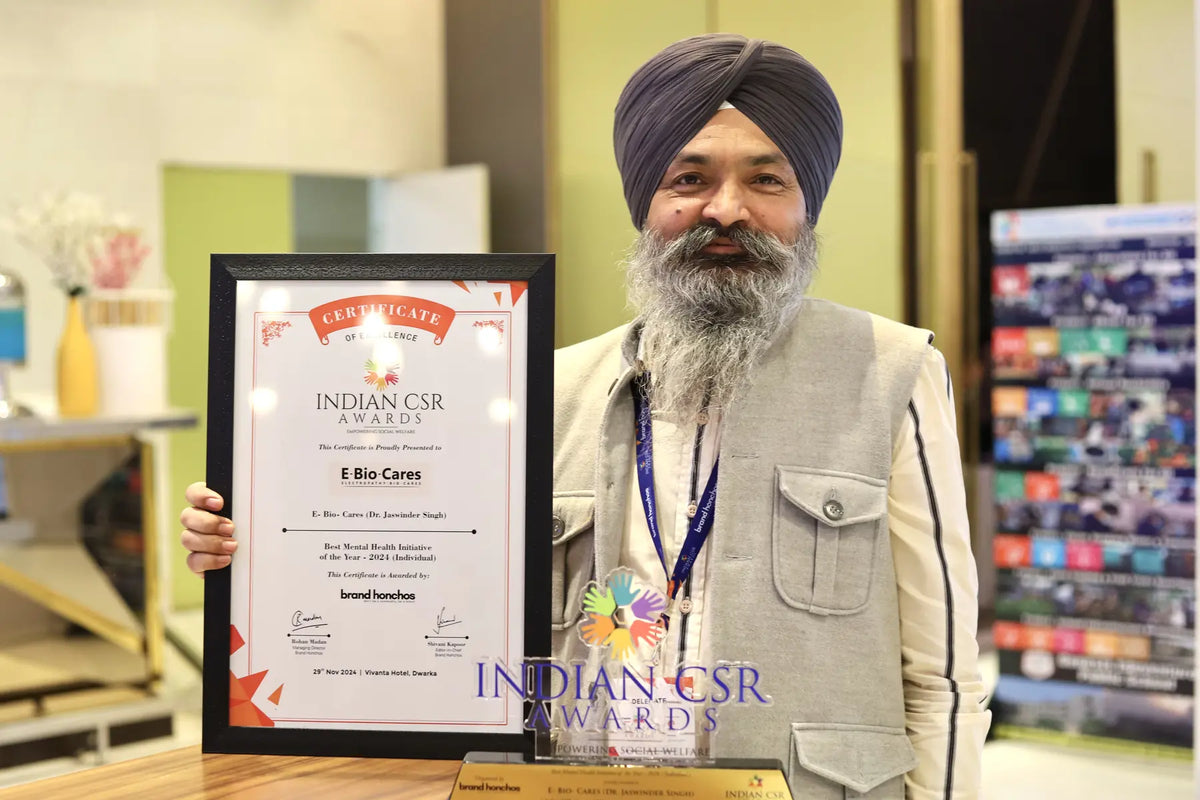 Dr. Jaswinder Singh with an E-Bio Cares recognition certificate