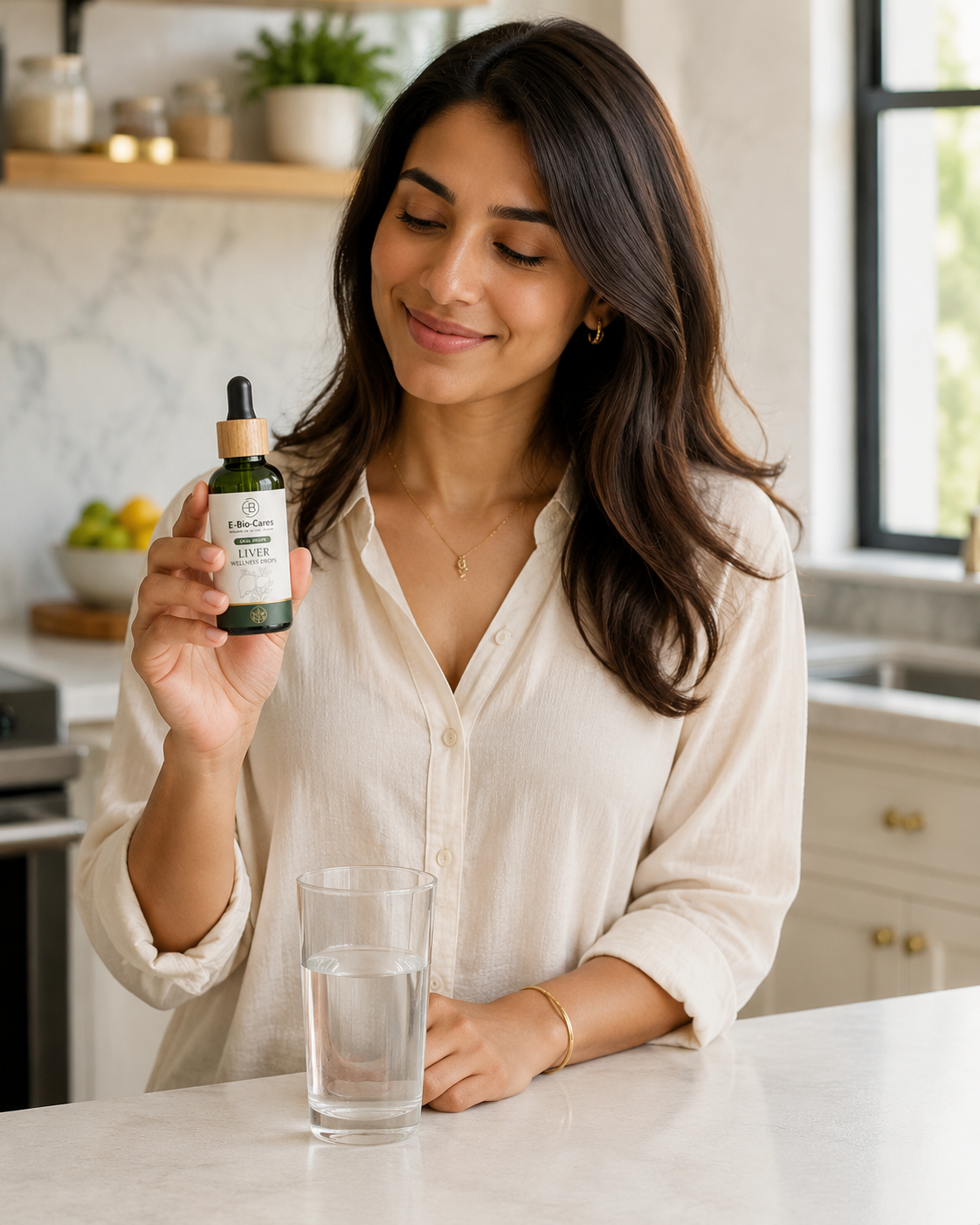Woman holding Bio Liv Drop beside water